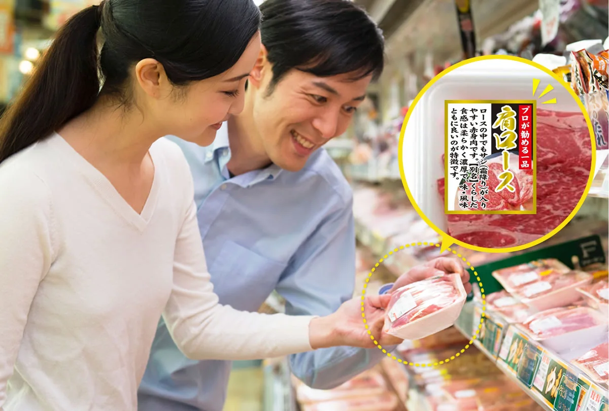 A shopper looking at product labels in a refrigerated meat case